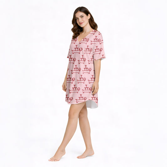 Women's pajama set with a fun pink pattern featuring cartoon dachshund dogs balancing martini glass towers, perfect for dog lovers and cocktail enthusiasts.