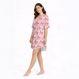 Women's pajama set with a fun pink pattern featuring cartoon dachshund dogs balancing martini glass towers, perfect for dog lovers and cocktail enthusiasts.