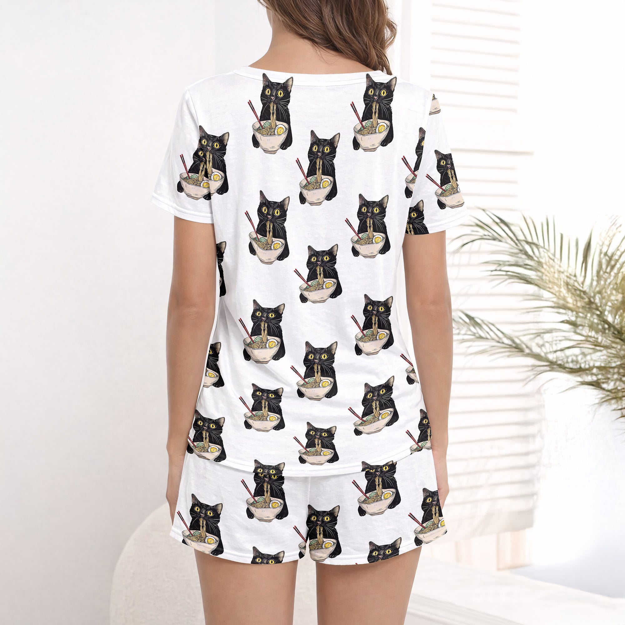 Women's pajama set featuring an all-over print of cute black cats eating ramen noodles, perfect for cat lovers and foodies.