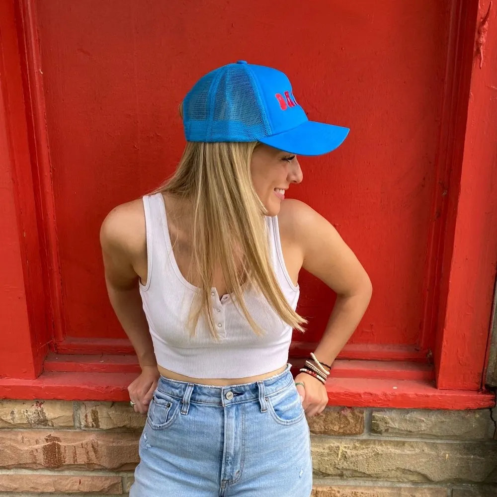 Combine a vintage trucker hat with a tank top