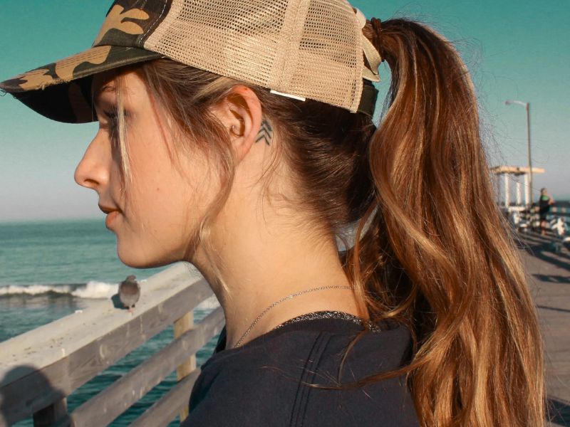 Wear a trucker hat with a Ponytail